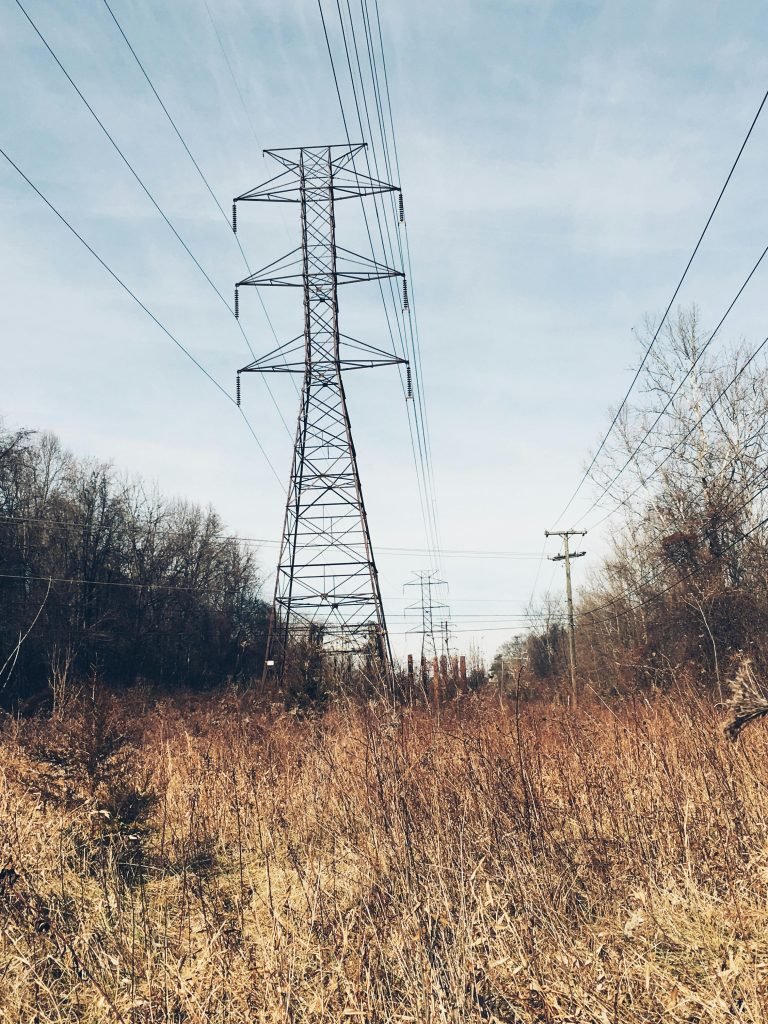 pexels-photo-816744-816744 Tall electrical towers and lines spanning a winter landscape beneath a clear sky.